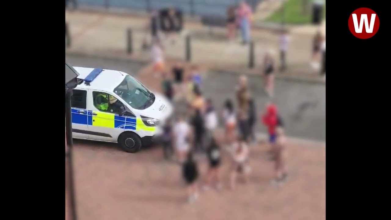 Teens surround police car and shout abuse at officers