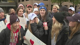 Fans react to seeing their favorite players during Atlanta Braves' World Series parade celebration
