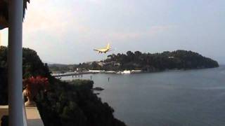 CORFU - .KERKYA AIRPORT  ,  JUST BEFORE LANDING , AIRPLAINES FLYING OVER MOUSE ISLAND .....