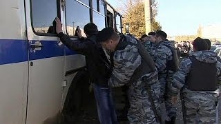 Russian police round up migrants in wake of Moscow riot