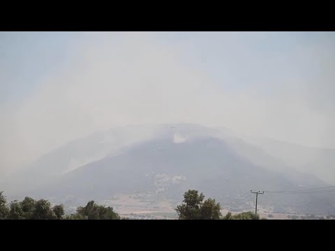 Smoke clouds rise in sky over Megara as helicopters battle Greece wildfire