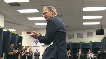 Brian Schmetzer congratulates the team in locker room following win