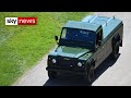 Prince Philip's custom-built Land Rover arrives at Windsor Castle before collecting his coffin.