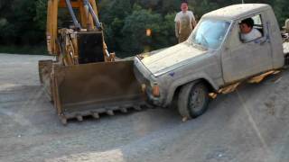 gene wrecking the jeep comanche into a bull dozer over a rock mound