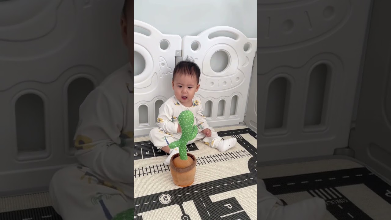 Adorable toddler startled by mimicking dancing cactus toy in Hebei, China