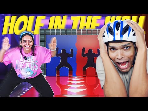 playing HOLE IN THE WALL (Very Funny) 😂