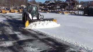 SnoWay Adjustable wing plow on a skid steer!
