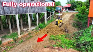 Fully operational with experts working on bulldozers to push the soil in the corners of the house