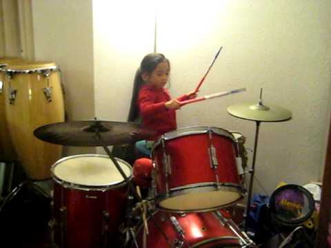 Kalina plays drums at her sister Veronica's baptis...