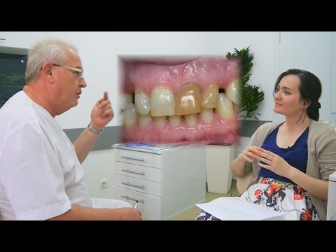 Почему темнеет коронка зуба ?