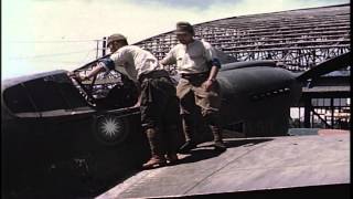 Japanese soldiers look into cockpit of captured American Curtiss P-40 fighter pla...HD Stock Footage