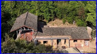 Skilled workers renovate the old house in the countryside with wood paneling