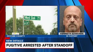 Fugitive in custody after standoff in Oconee County