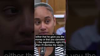 Judge explains his conditional deal: come back in a month with proof of payment or canceled regis