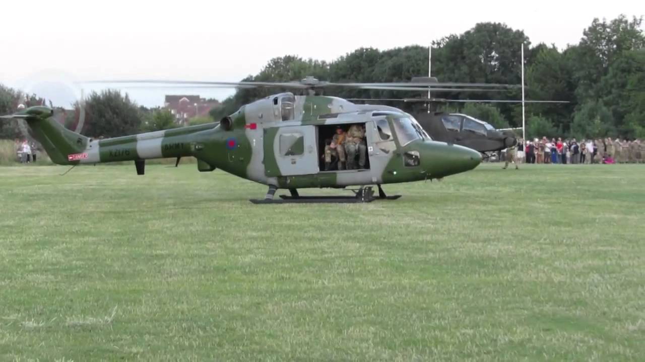 AH-64 army attack helicopter and Lynx taking off
