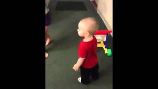 Zachary Walks Through A Hallway