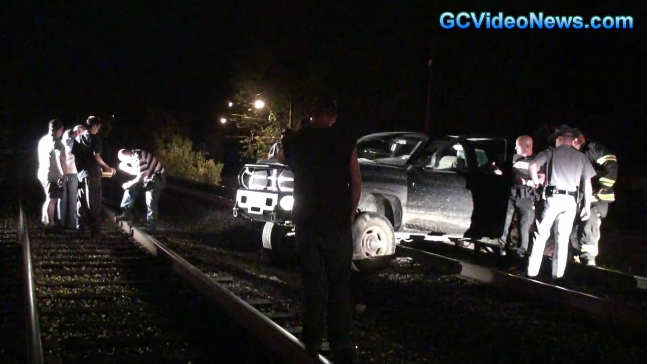 Truck stuck on railroad tracks - YouTube