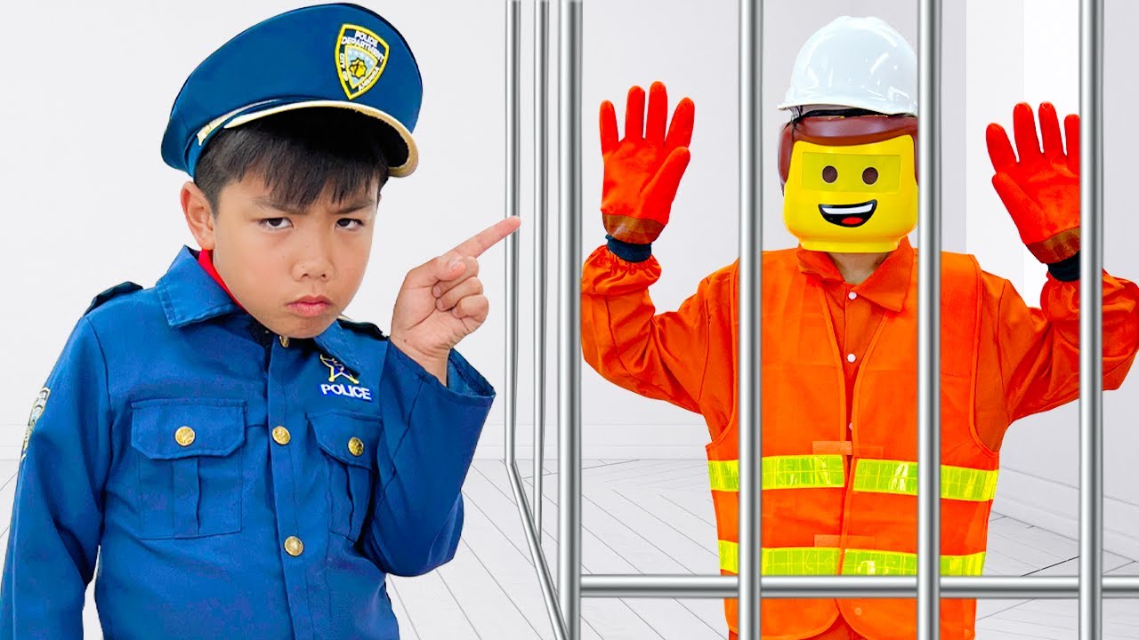 Eric and Charlotte Pretend Play with Toy Blocks and Lego Man