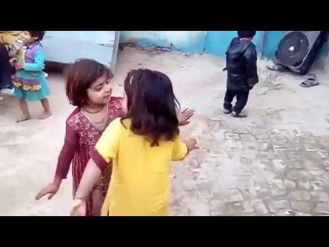 Two little girls dance