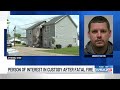 Person of interest in custody after fatal fire