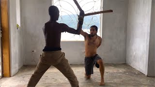 Roland training Lucas with sticks ~ Haitian Machete Fencing  (Summer 2021)