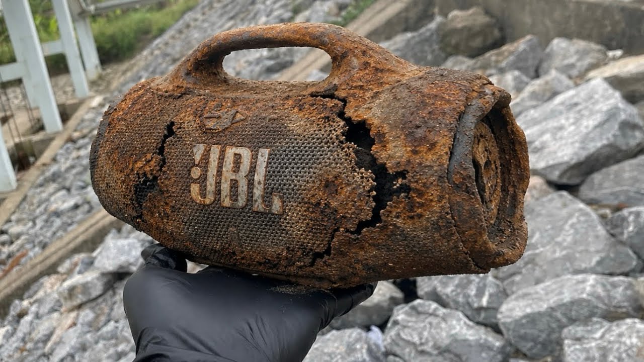 A master repair technician perfectly restores a JBL portable