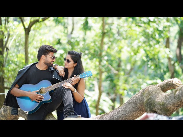 Close up of music couple playing guitar and singing to each other while  their friend is taking a photo Stock Photo - Alamy