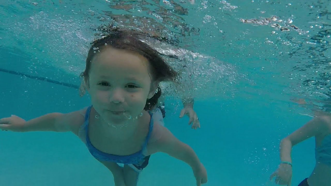 Children Swim Underwater