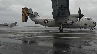 A Grumman C-2A Greyhound lands aboard the flight deck of USS Nimitz on Jan 27, 2023.