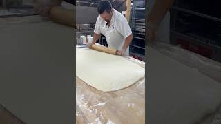 Cinnamon Roll Step 1: Rolling the dough thin and shaping it just right! #fyp Full video on #youtube