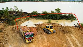 Wonderful Machine Bulldozer KOMAT'SU D65PX Pushing Soil Into Water And 25.5 Ton Trucks