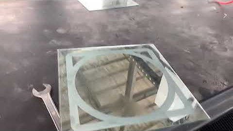 Mirror back processing machine