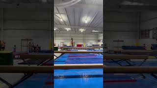 Backhand spring back layout step out on high beam