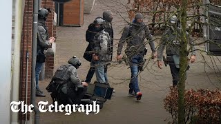 Hostages held inside Dutch Cafe as armed police deployed to scene