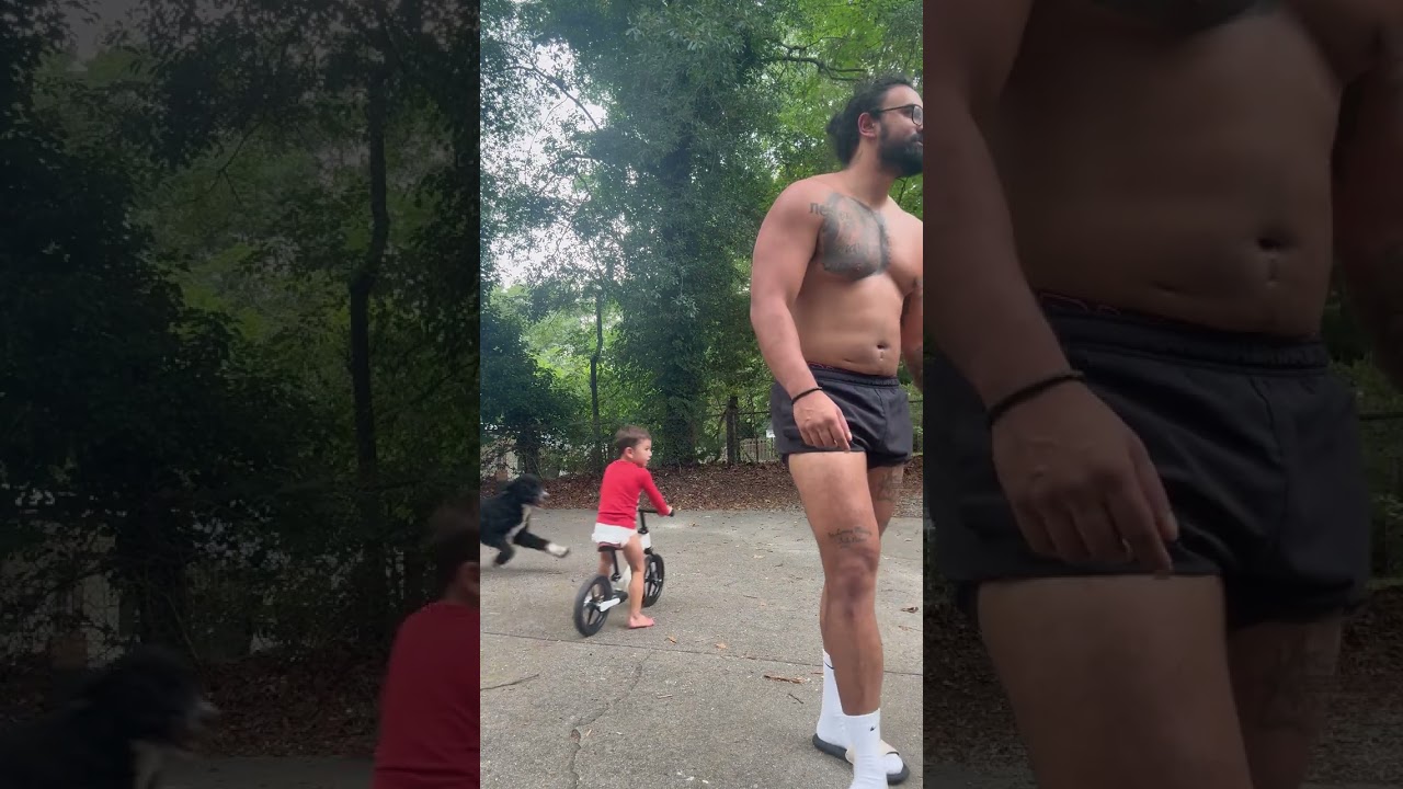 Guy records a video of himself them boy riding bike gets tripped and falls over dog