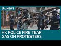 Police fire tear gas during protest in Hong Kong as opposition to new law grows | ITV News