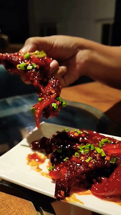 Baby pork spare ribs with star anise infused plum glaze, pull apart, fall of the bone meat and fat