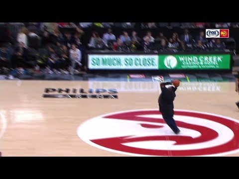 Hawks fan drills half-court shot for $10,000 | ESPN