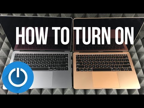 How do I turn on my Mac laptop?