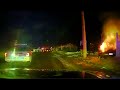 Dashcam video of police rescuing a man from a burning vehicle in Grand Island