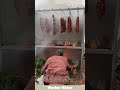 Smoked cured meat, slow-smoked with woods like fruitwood or pine.