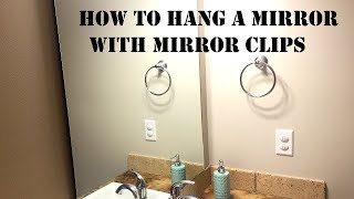 In this video I show how to hang a wall mirror with mirror clips.