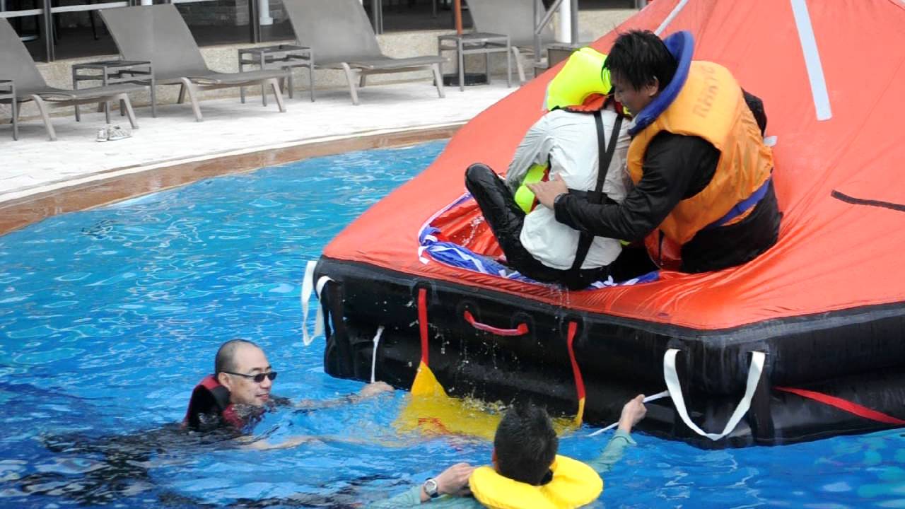 Safety at Sea Course in the Club pool - hauling an 'injured' person into the liferaft