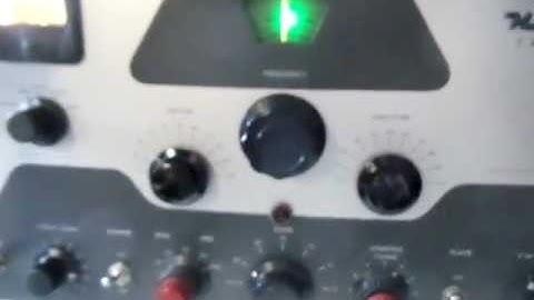 K7PP,  Zero beating an AM signal with a HeathKit DX-100 Ham Radio