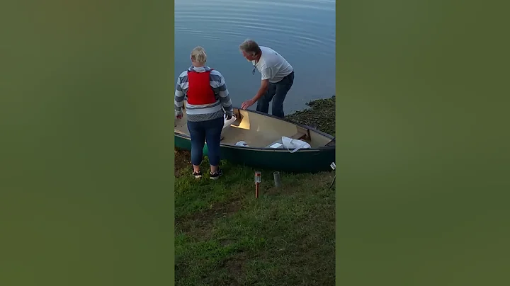 My daughter going in a canoe for the first time