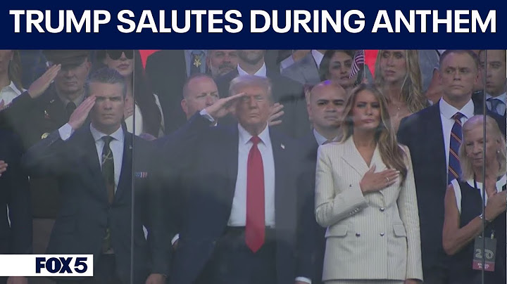 Military parade: Trump salutes during national anthem