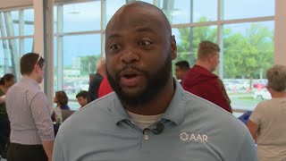 Job hunters meet prospective employers at airport job fair