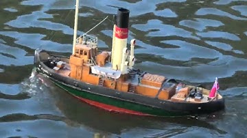 Nicely made RC tug has a run on the pond