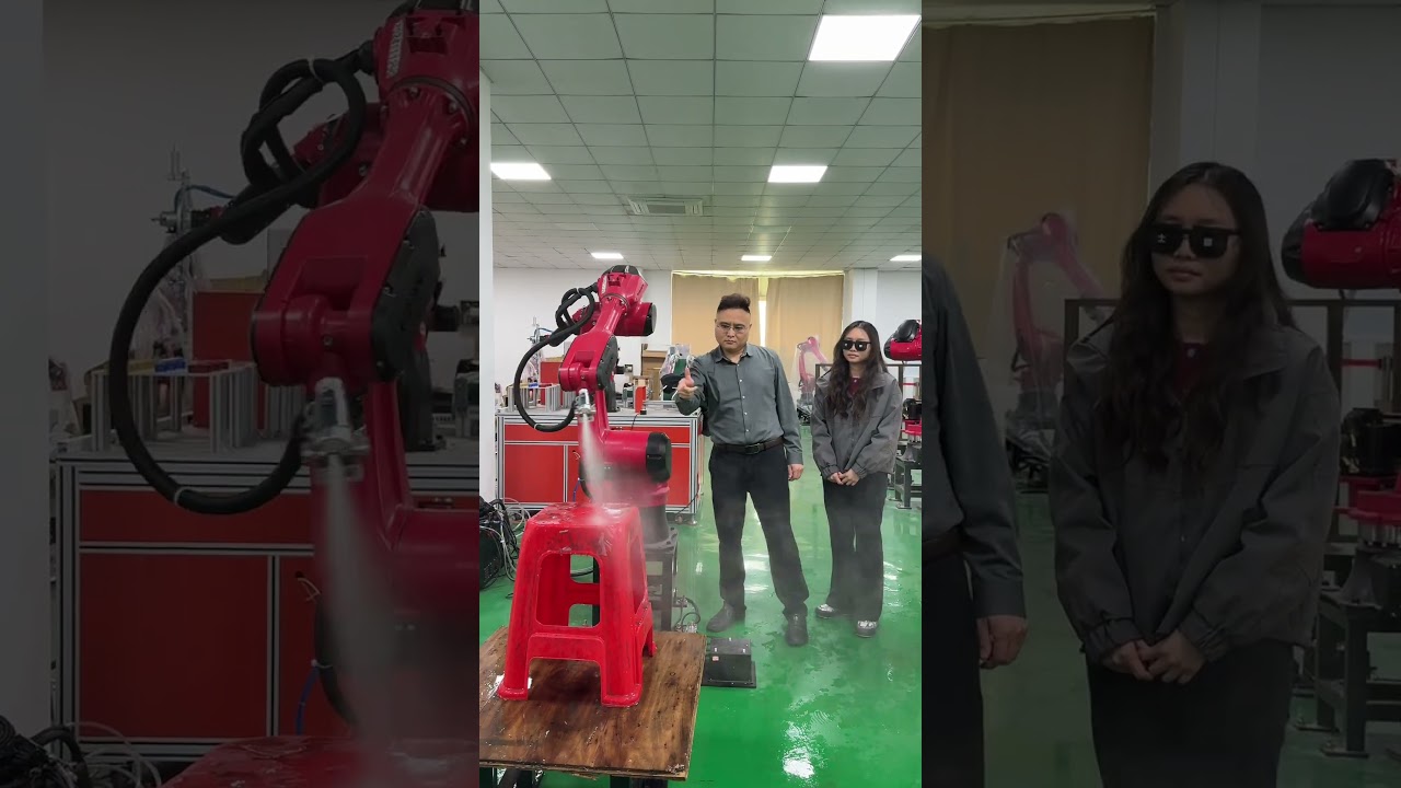 Manually taught paint spraying robot