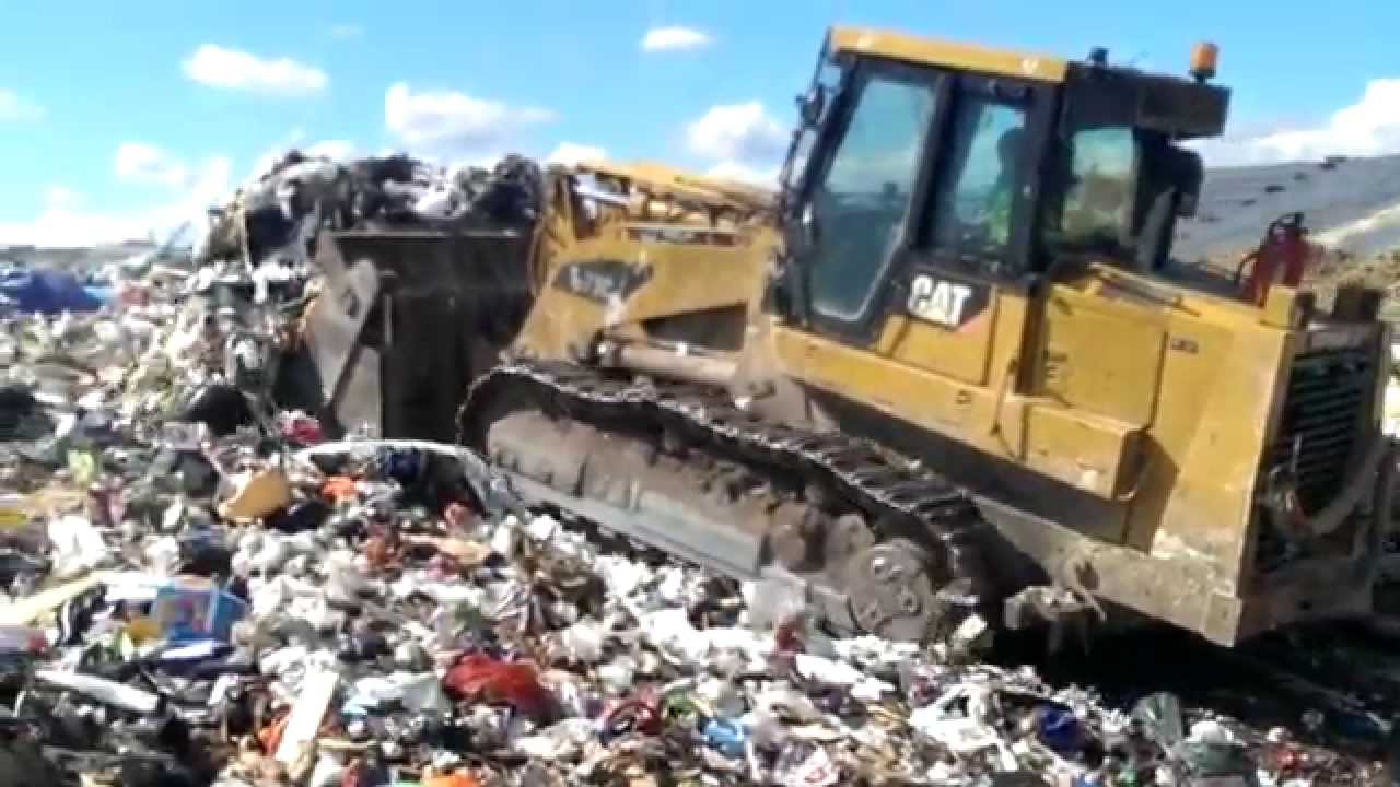Cat 973c on landfill - YouTube